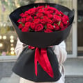51 red roses in black wrapping, Wroclav